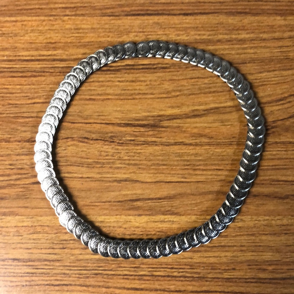 Silver tone Metal Stretchy Belt. 25”. Concho style